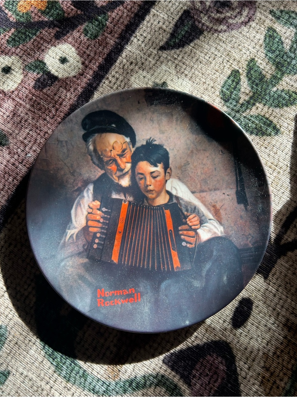 Norman Rockwell “The Music Maker”Plate Featuring Orange-Accented Accordion Scene